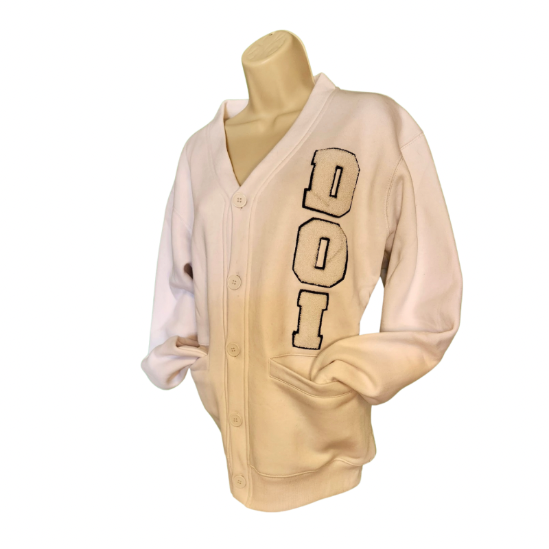 Daughters of Isis white fleece cardigan front view with chenille DOI letters